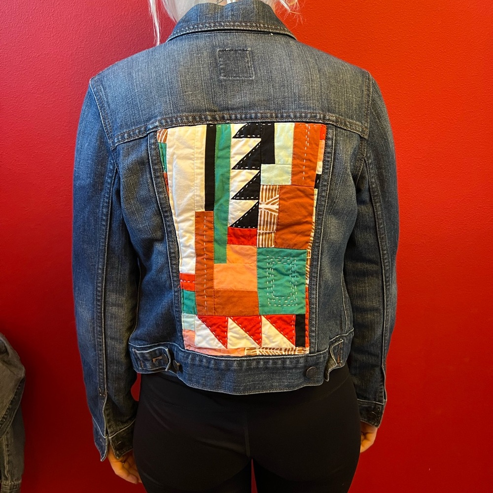 Jean Jacket. Old Navy brand with With beautiful decorative pattern.Size M.